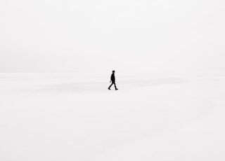 person walking on snowfield