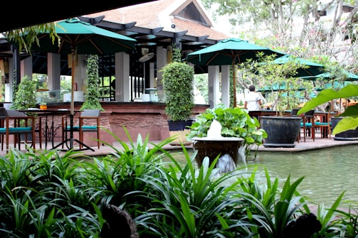 A quiet outdoor patio space with greenery and seating, ideal for relaxing after work.