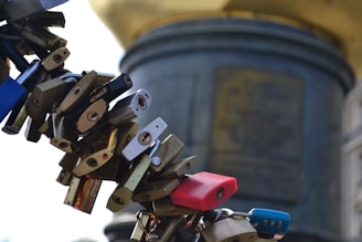 Various padlocks and small hardware accessories hanging on a display rack.