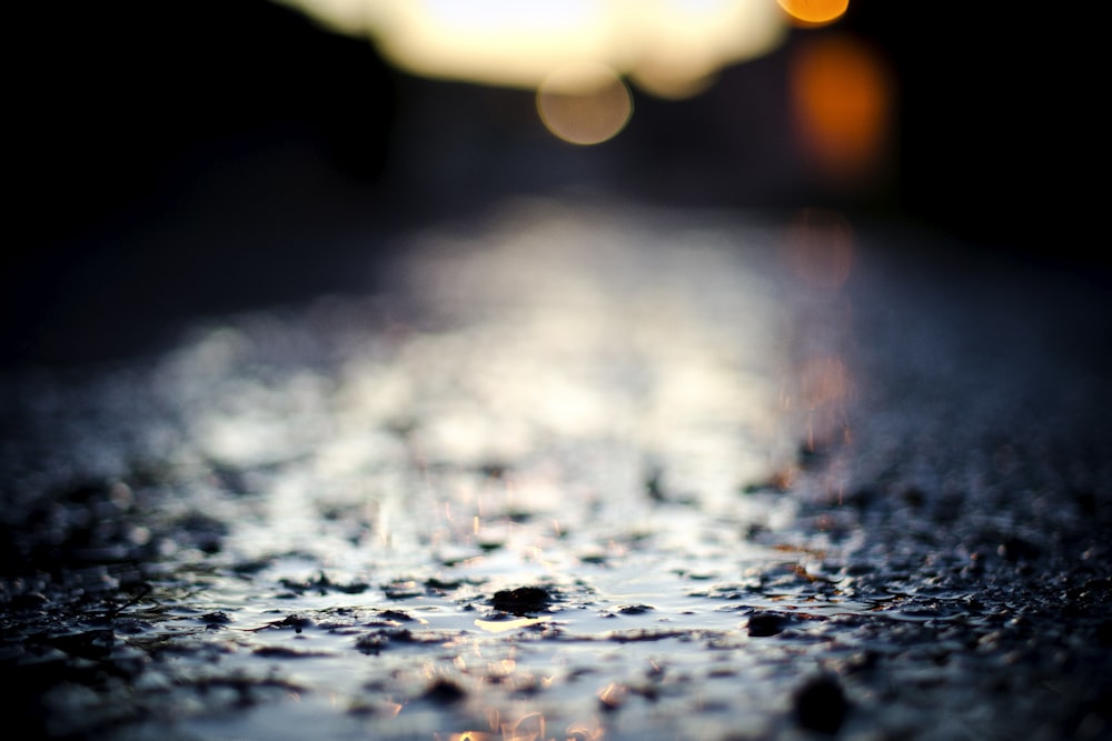 a close up of a wet surface with a blurry background