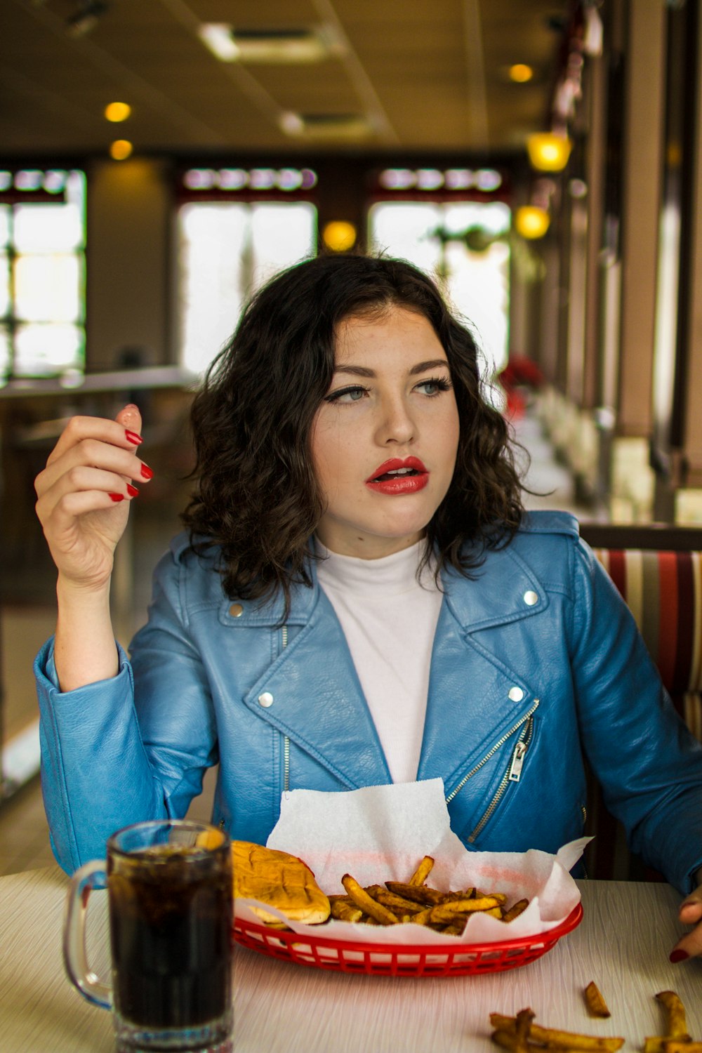 woman sitting beside table