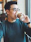 man holding Starbucks disposable cup