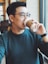 man holding Starbucks disposable cup