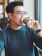 man holding Starbucks disposable cup