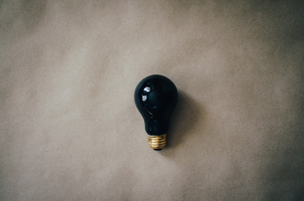 black light bulb on gray surface
