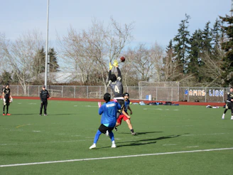 Action shot of a player making an impressive flag football catch during a weekend game.