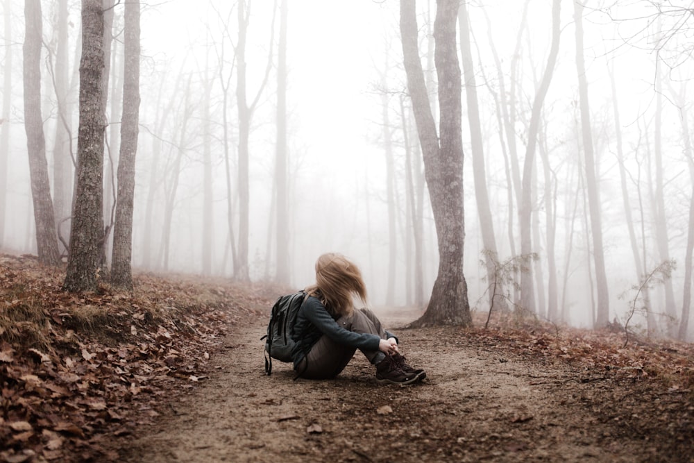 woman sitting on land