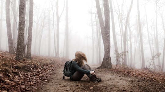 woman sitting on land