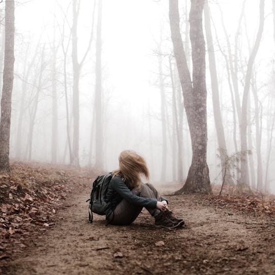 woman sitting on land