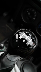 Close-up of a learner confidently shifting gears during a driving lesson.
