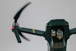 Behind-the-scenes view of a drone filming a motorsport race.