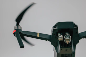 Close-up of a drone filming a construction site from above.