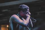 Stephen M. Francis III performing on stage with intense focus and energy.