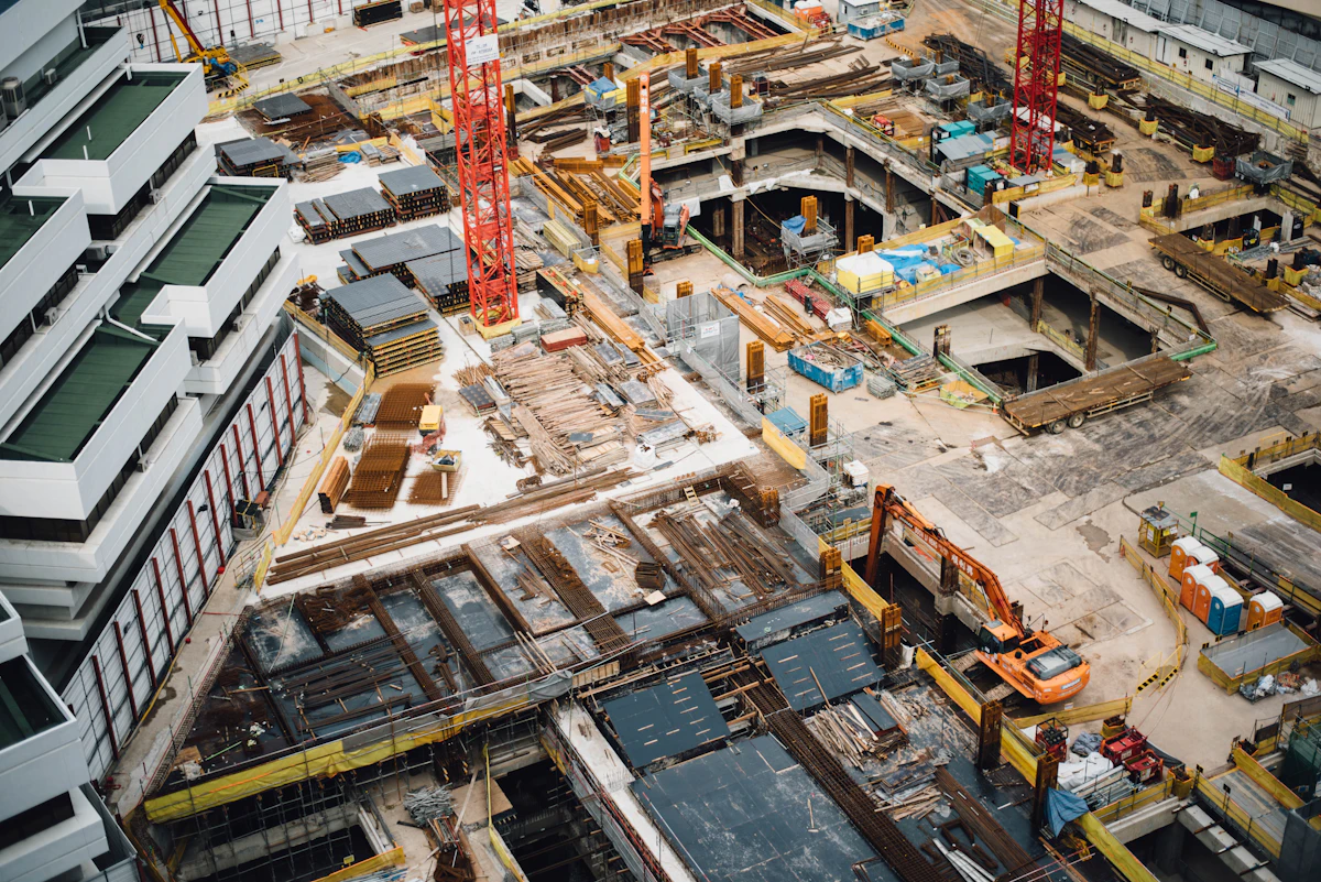 Aerial view of multi-story commercial construction site — typical Subpart R territory