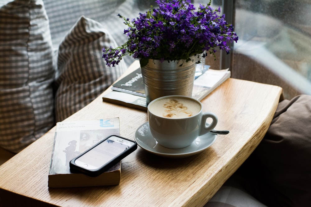 white ceramic mug with latte art