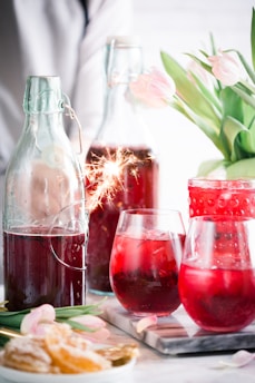 drinking glasses and bottles on table