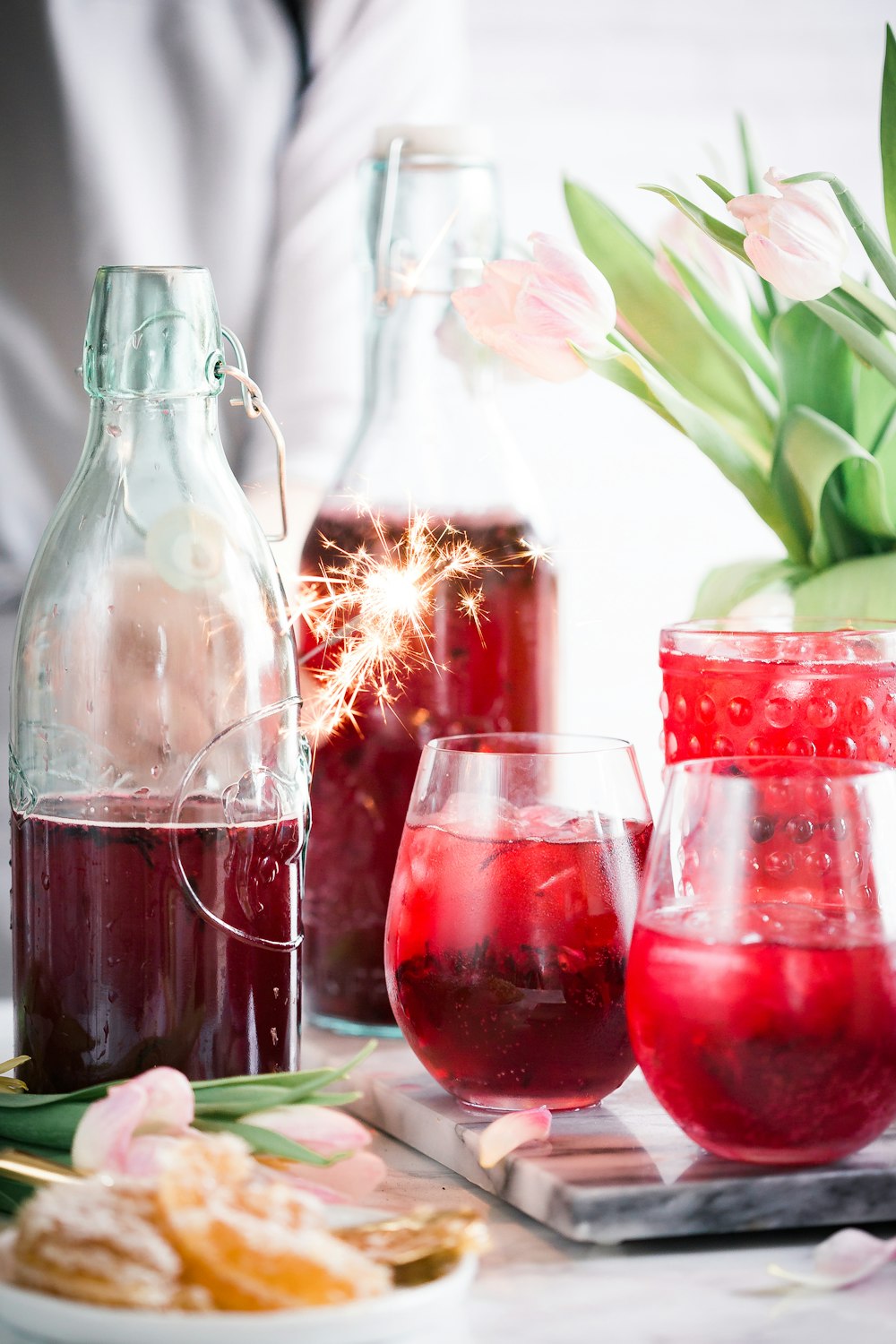 drinking glasses and bottles on table