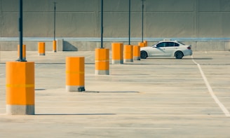 white sedan on parking lot during day time