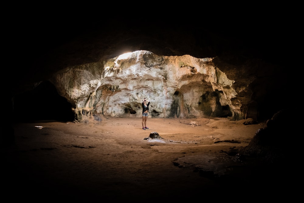 person standing in cave
