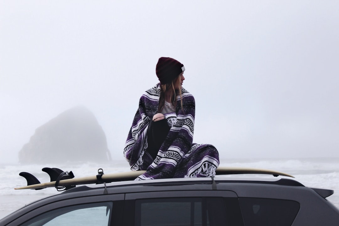 woman sitting black car