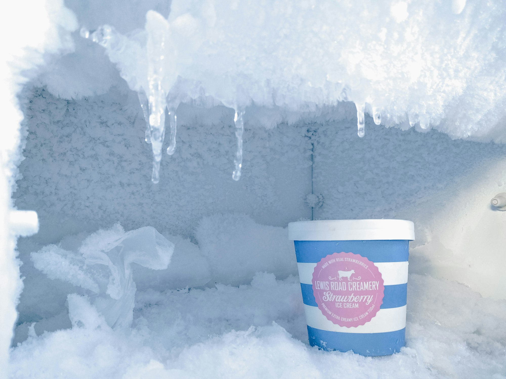 Ice cream inside a freezer with excessive ice build-up