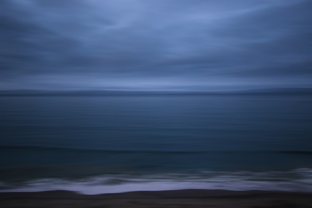 ocean under cloudy sky during daytime