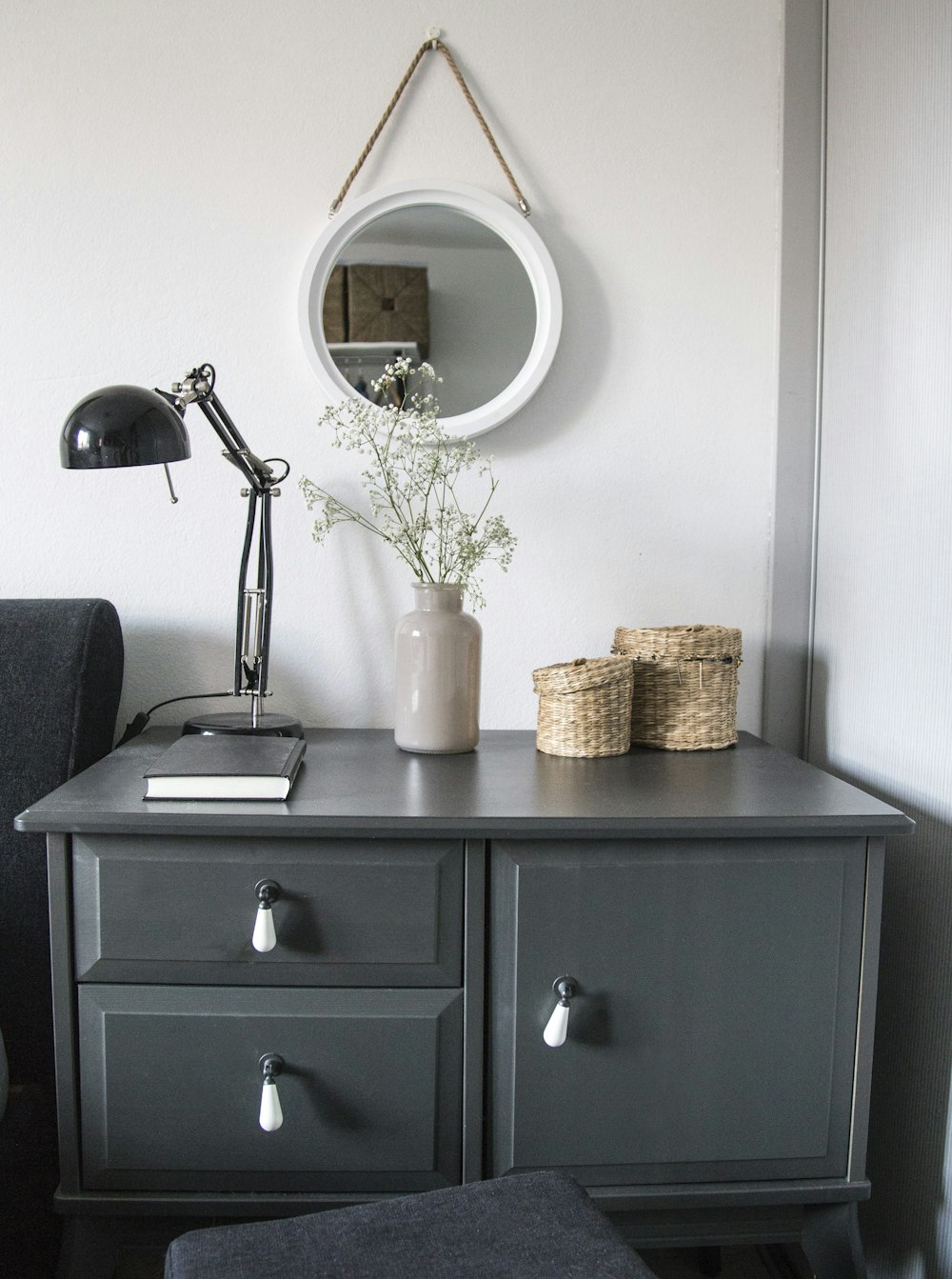 black desk lamp on black wooden drawer