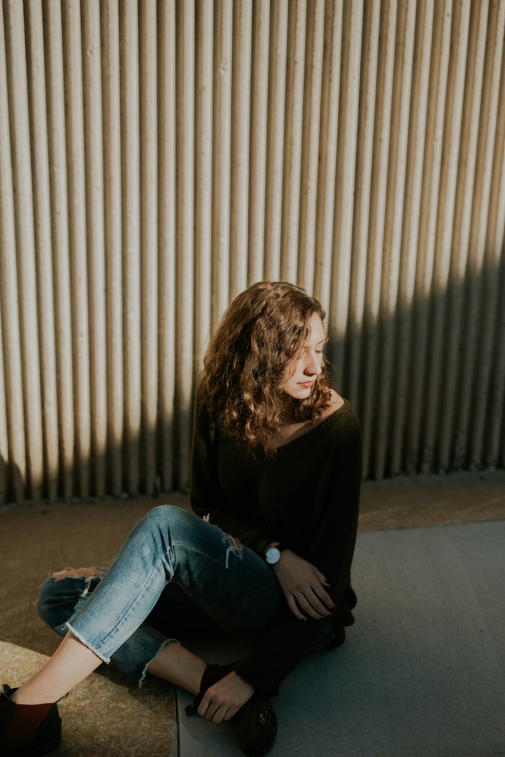 woman sitting on ground