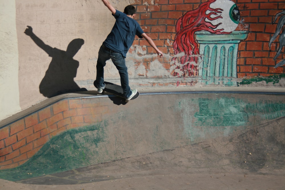 man skateboarding on concrete rail