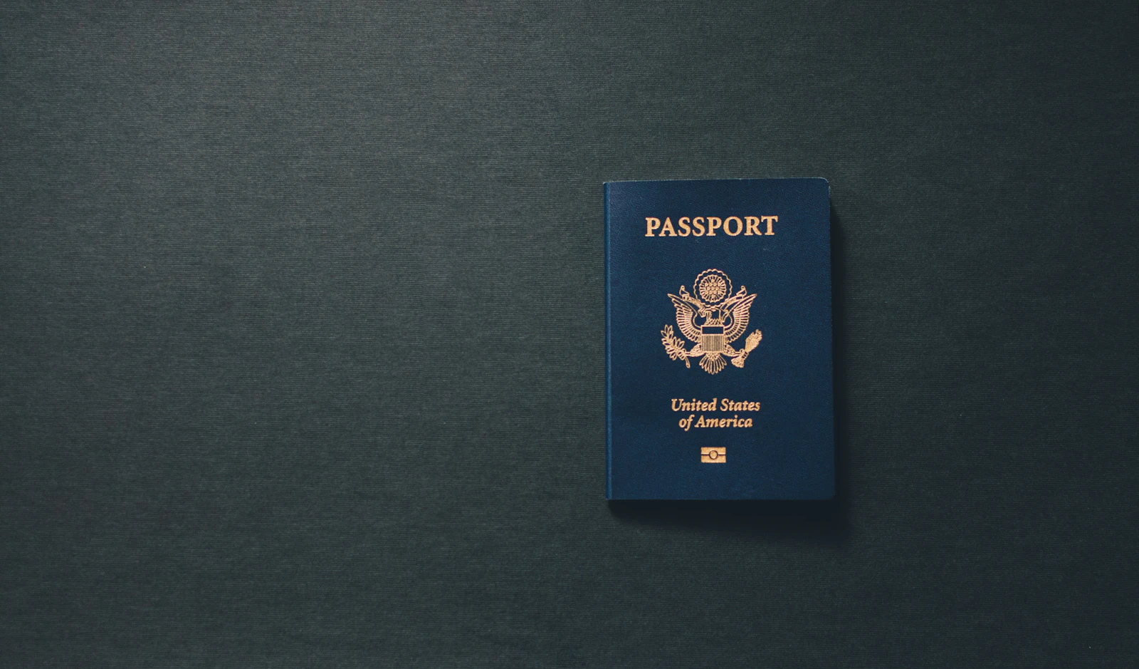 A United States passport on a dark surface