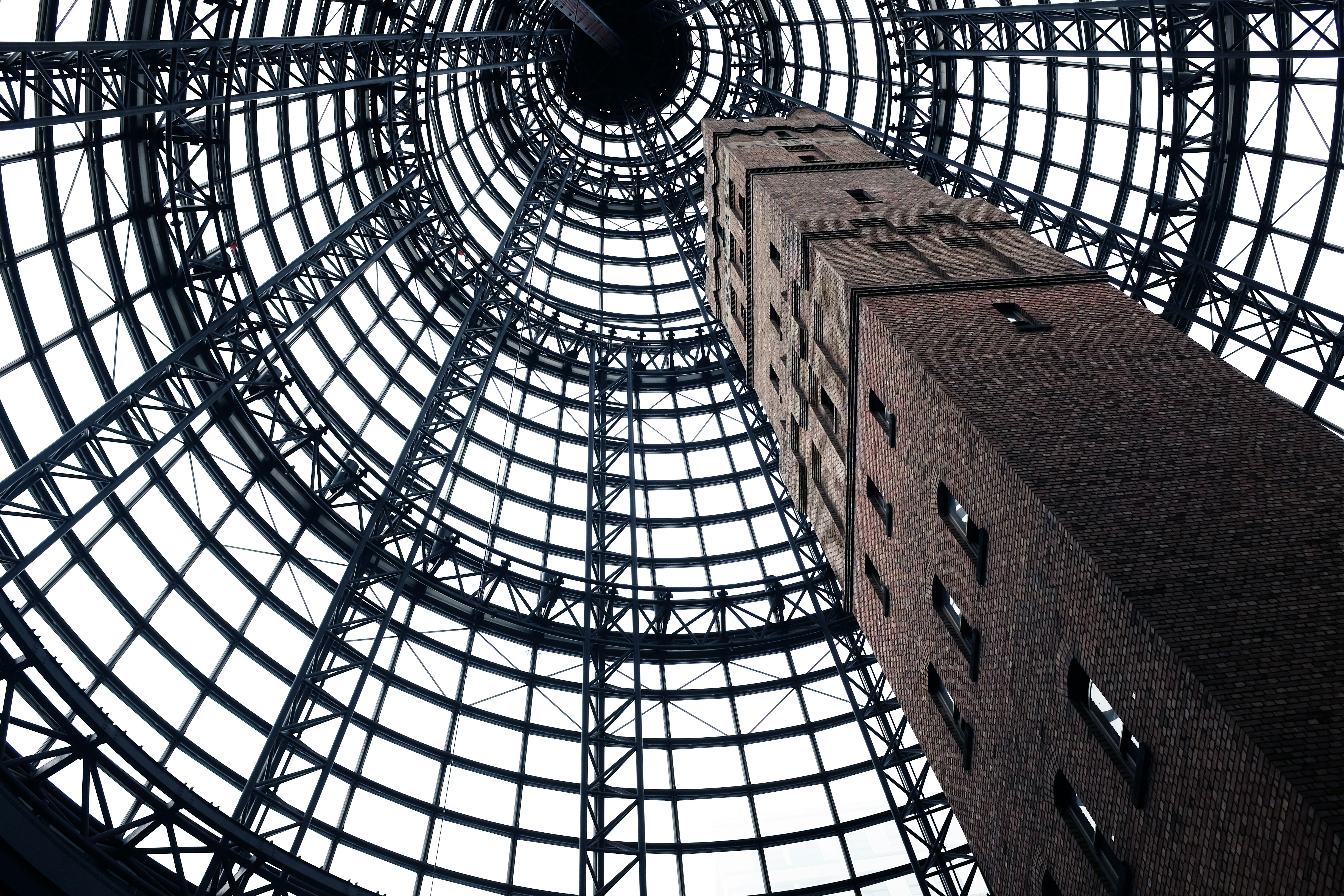 low-angel photography of gray concrete tower with windows