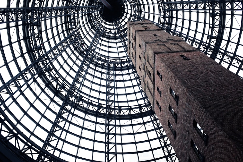 low-angel photography of gray concrete tower with windows