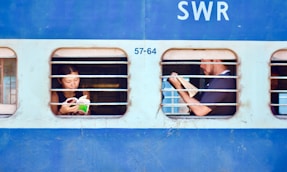 man and woman sitting on train