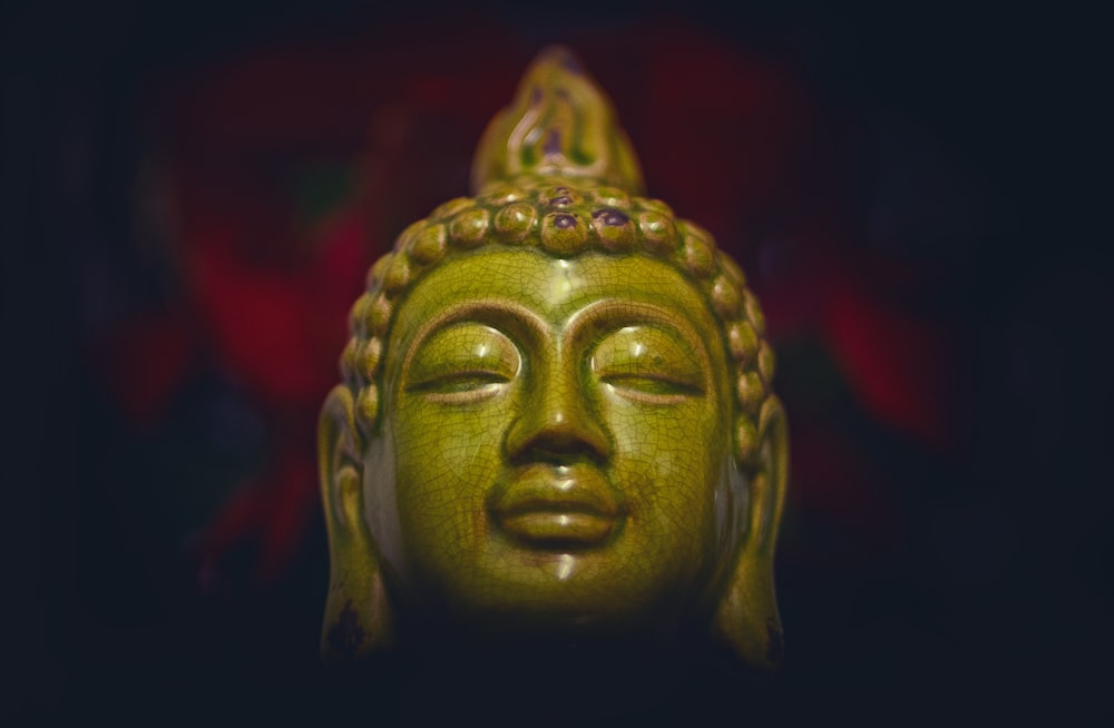 green ceramic buddha head