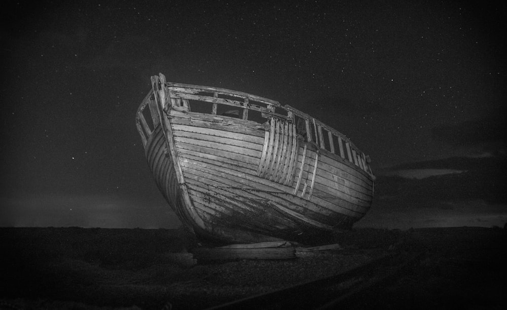 wrecked boat in monochrome photo