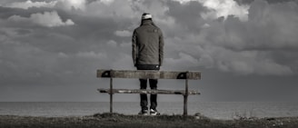 man standing near bench
