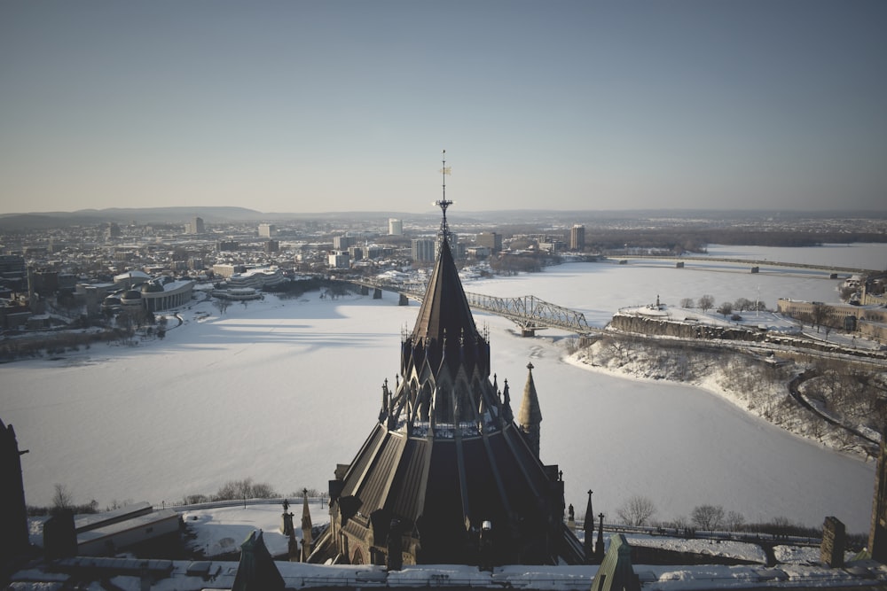 brown and black tower on snow covered ground during daytime