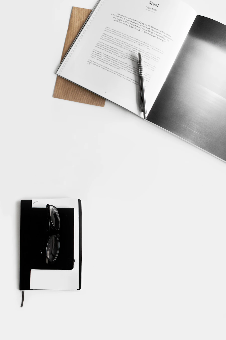 Reading glasses resting on an open book, illustrating ongoing research on AI-assisted meetings