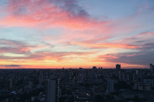 A colorful jigsaw puzzle featuring a vibrant cityscape at sunset.