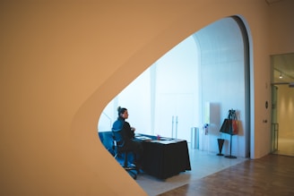 Modern architectural blueprint spread on a minimalist desk with natural light.
