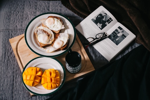 sliced mangoes served on white ceramic plate