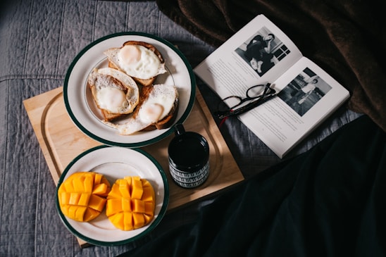 sliced mangoes served on white ceramic plate