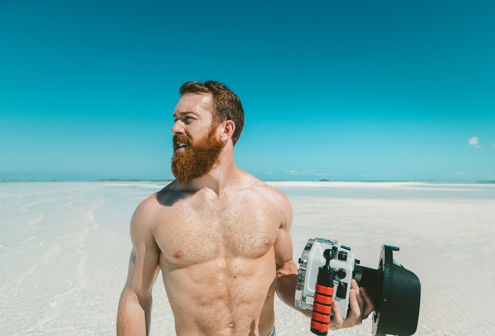 Man with a camera on a beach