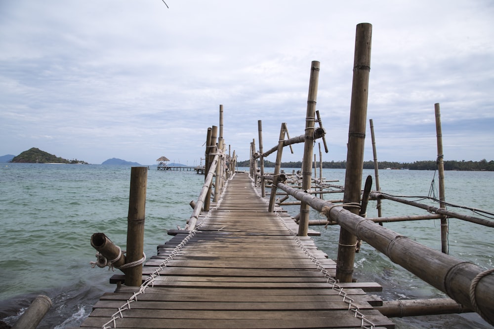 brown wooden dock on sea during daytime