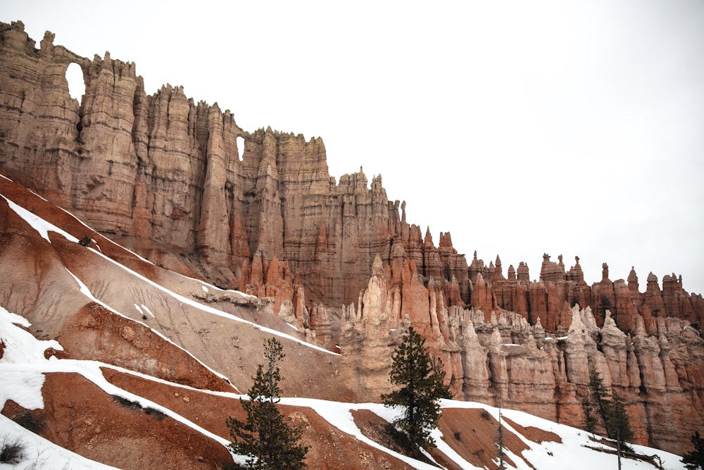 brown rocky mountain under white sky during daytime