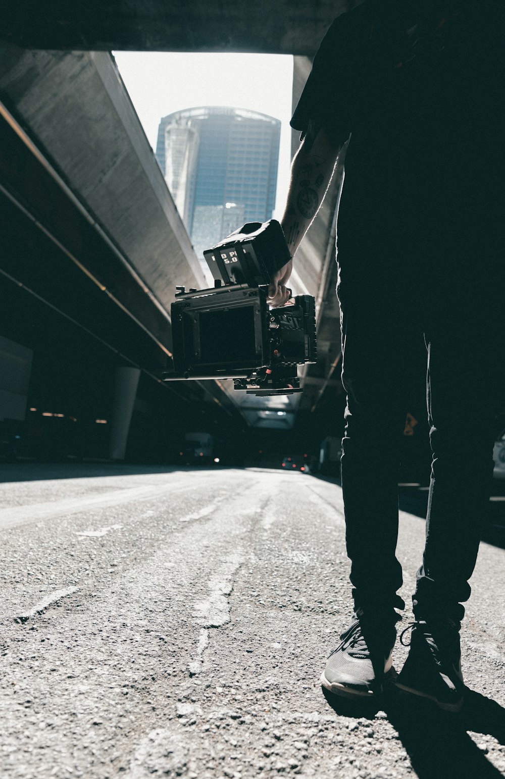 person holding camera with stabilizer