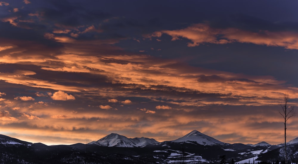 mountain under cloudy sky during day time