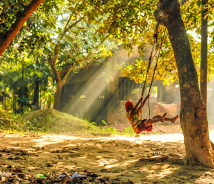 A warm, inviting orphanage garden with children playing under the sun.