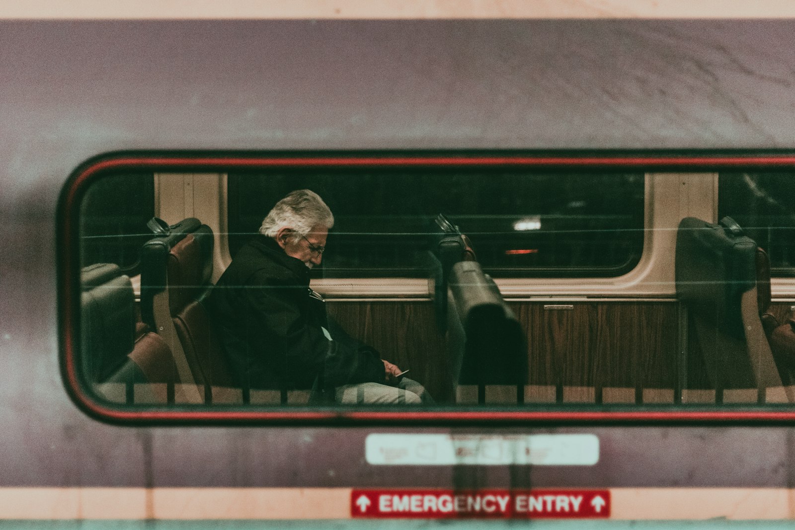 Canon EOS 750D (EOS Rebel T6i / EOS Kiss X8i) sample photo. Man sitting on train photography
