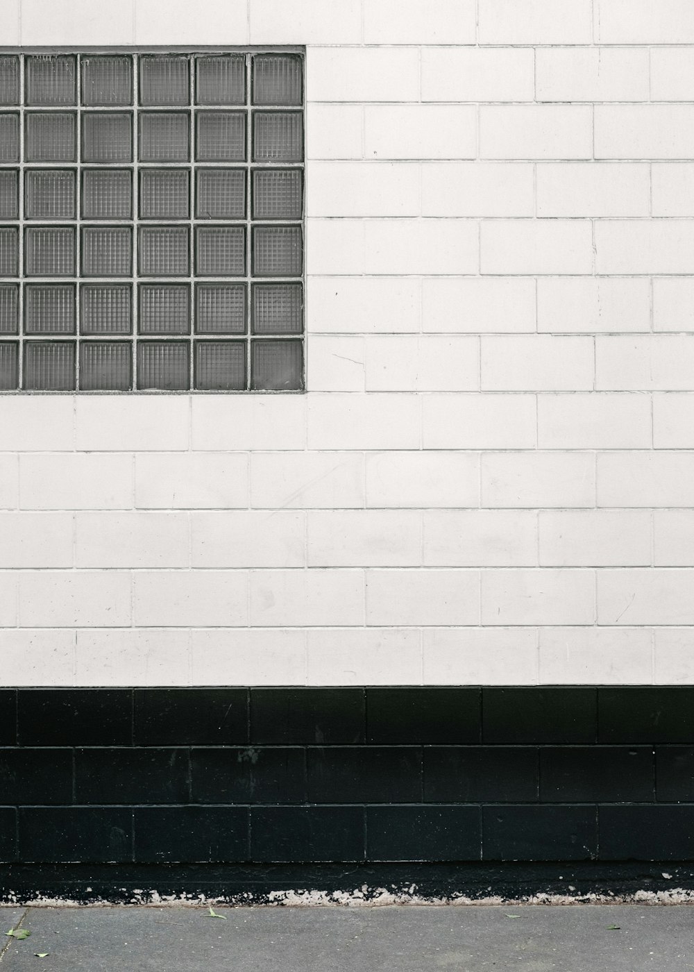 white and black wall with glass block windows